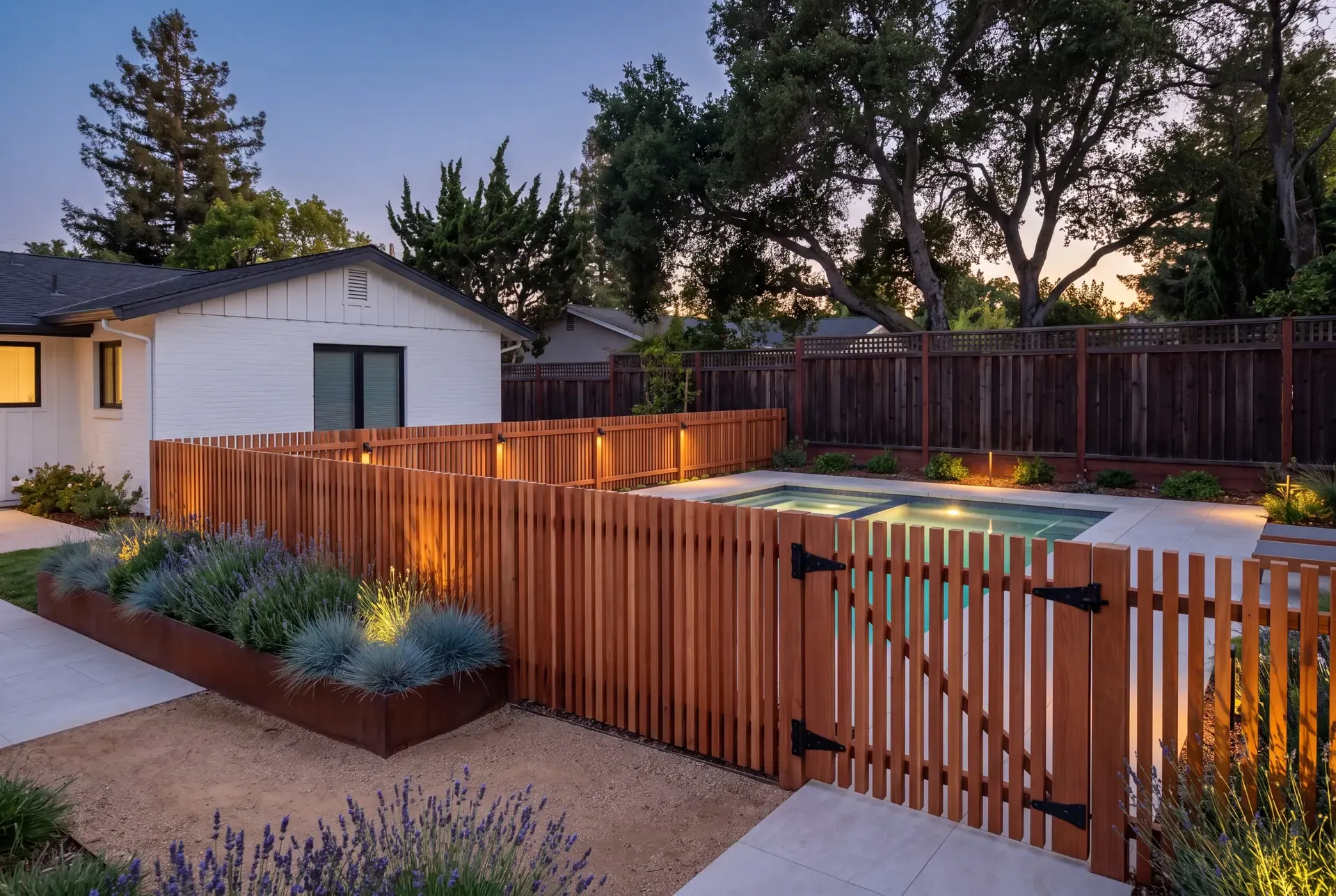 Five-foot redwood pool enclosure with a self-closing gate around a small backyard pool