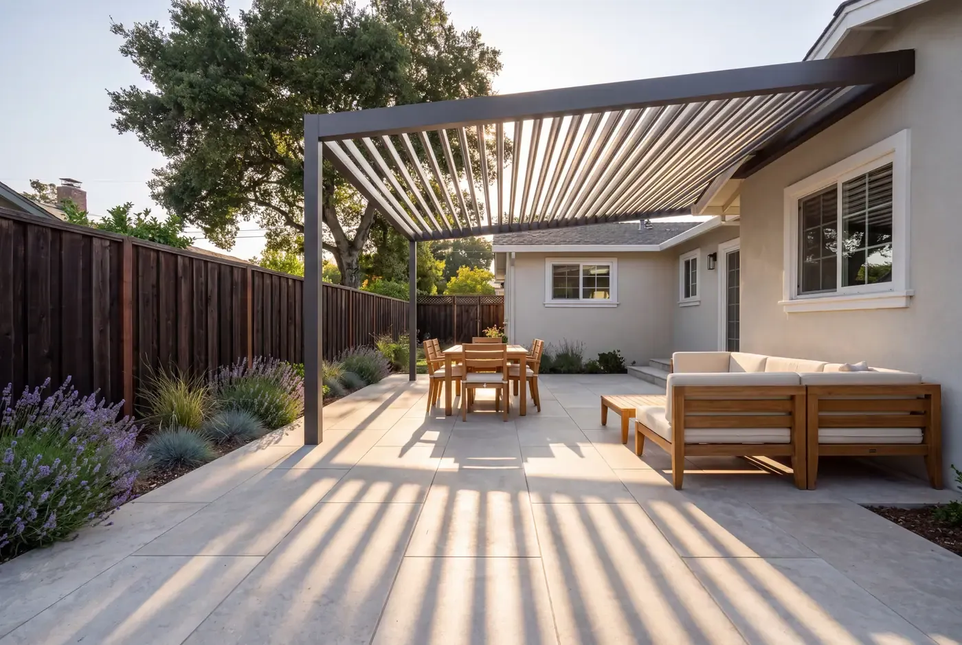 A backyard pergola with east-west oriented slats showing the consistent shade pattern on the patio below