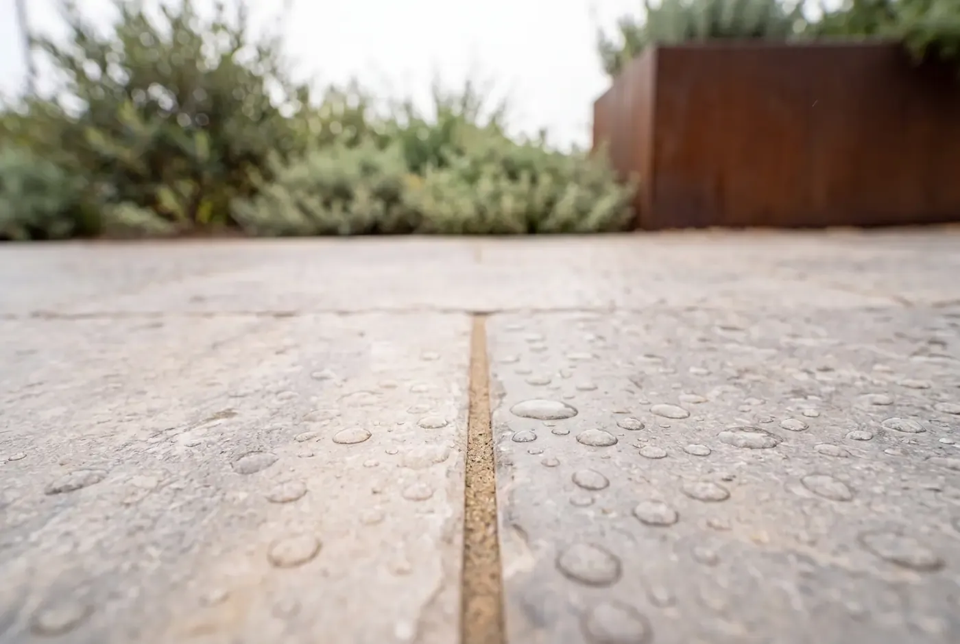 Close-up of porcelain paver surface showing textured finish and tight joints